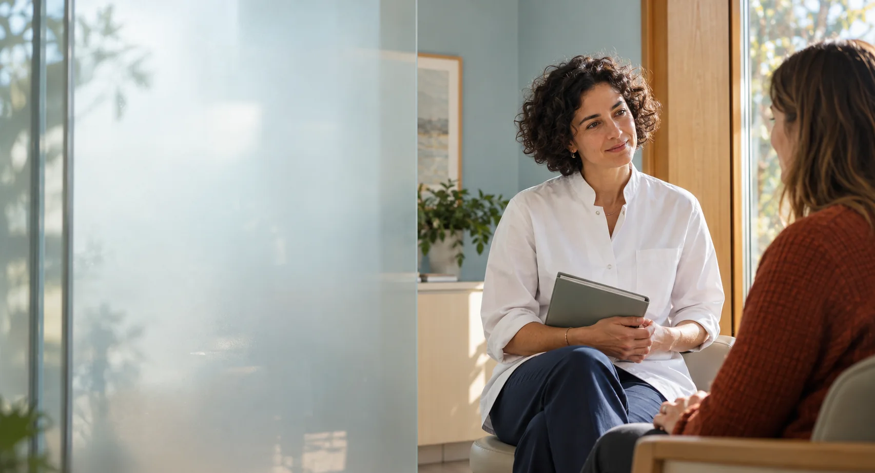 A physician speaking with a patient in an independent local practice