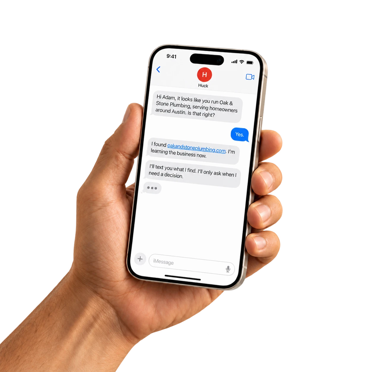 A hand holding a phone with a Huck text conversation
